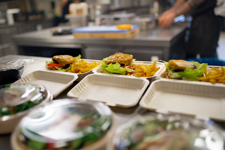 The meals containers prepared for take away in kitchen restaurant.