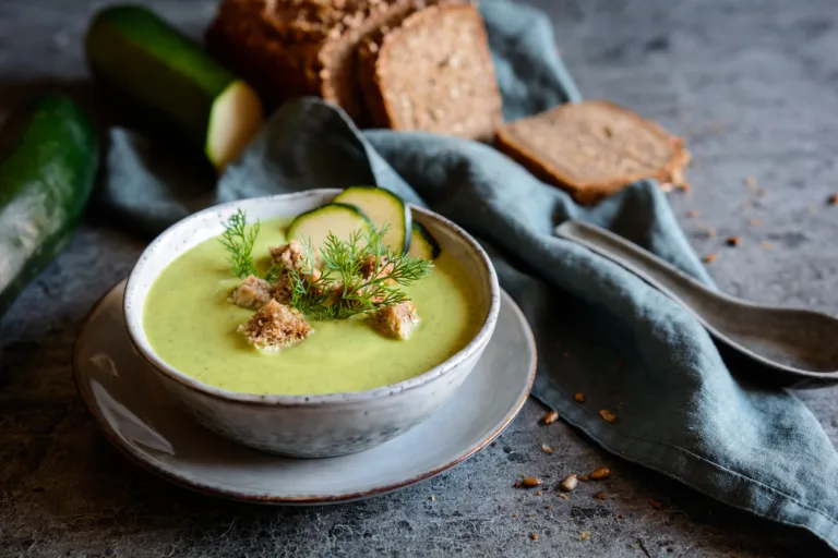 Creamy zucchini soup with croutons in a bowl