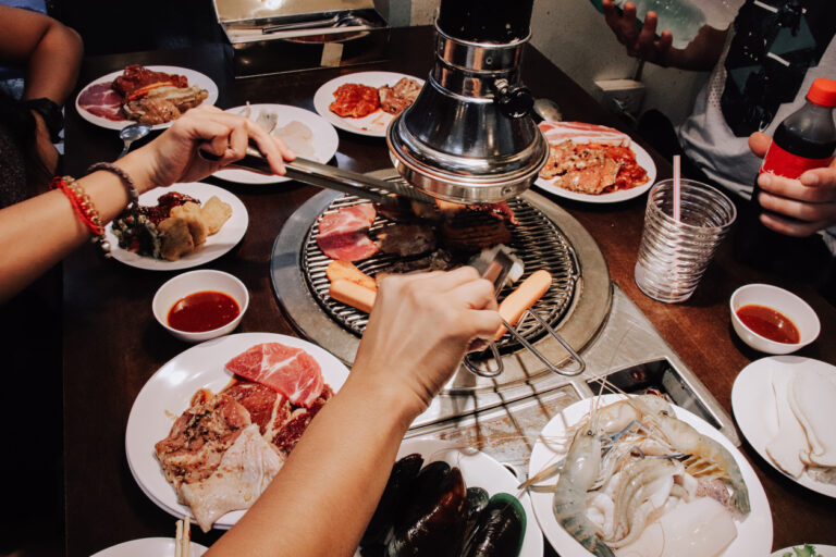 Sharing a meal at a traditional korean bbq, known locally as gogi-gui